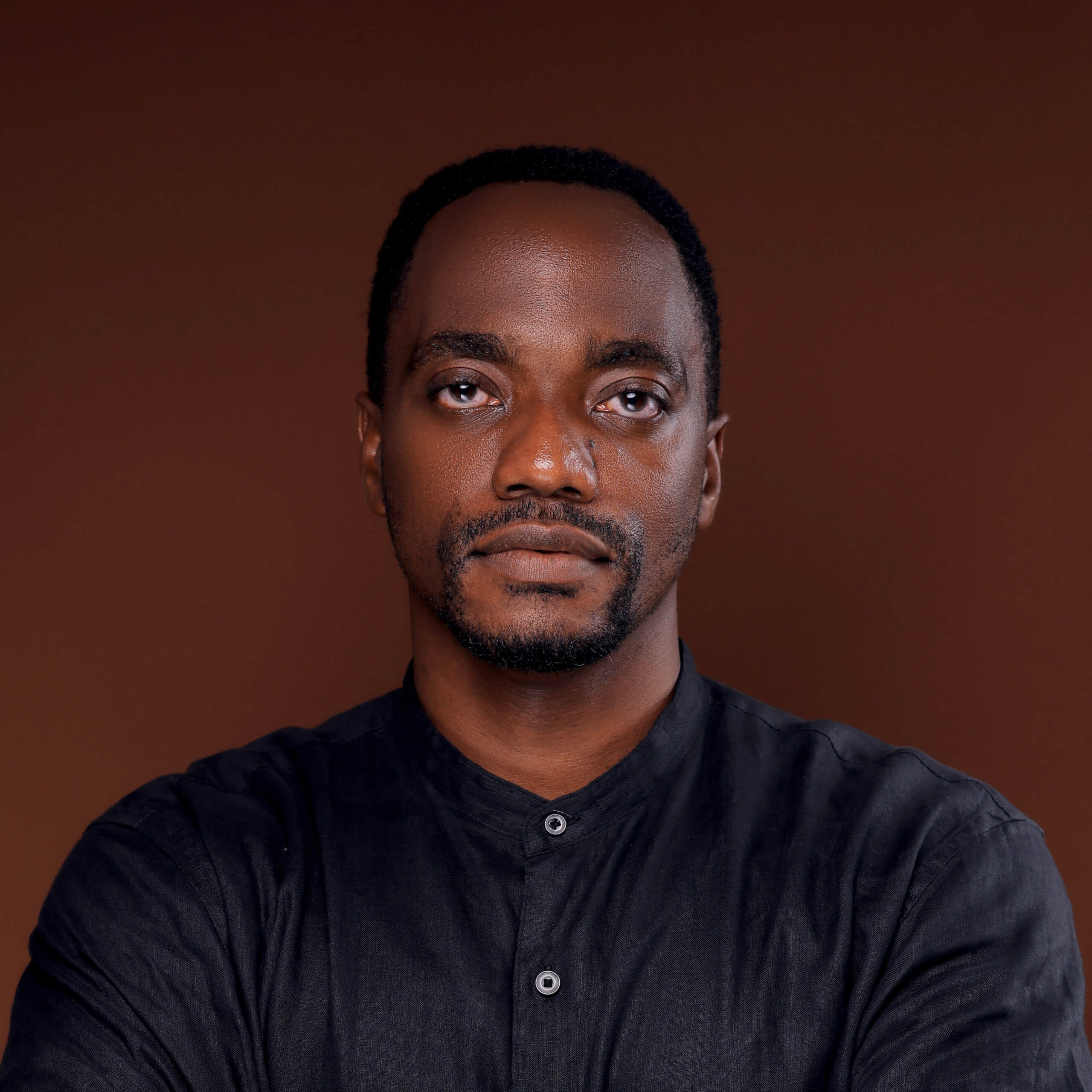 Abu Mwesigwa in suit